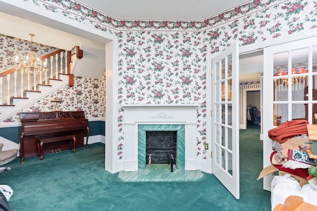 carpeted living room with an inviting chandelier