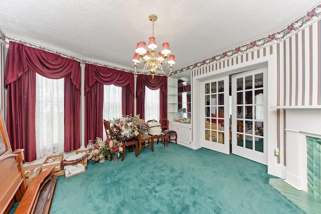 interior space featuring carpet, a textured ceiling, and a chandelier