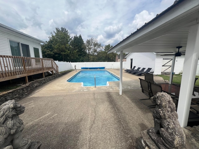 view of pool featuring a deck, ceiling fan, and a patio area