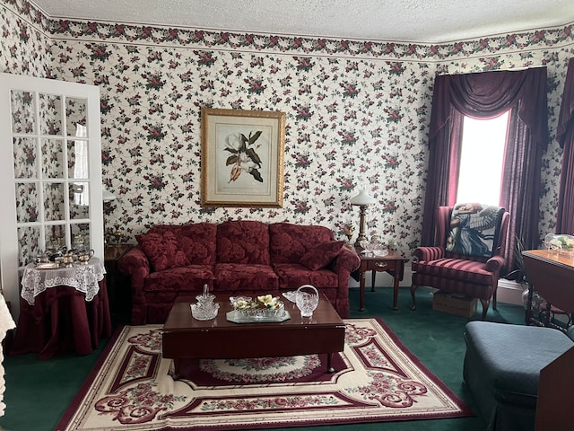 living room featuring carpet floors and a textured ceiling