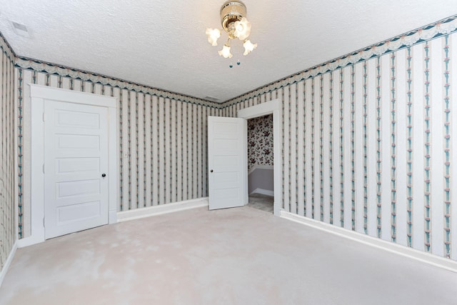 unfurnished bedroom featuring carpet flooring, a textured ceiling, and a closet