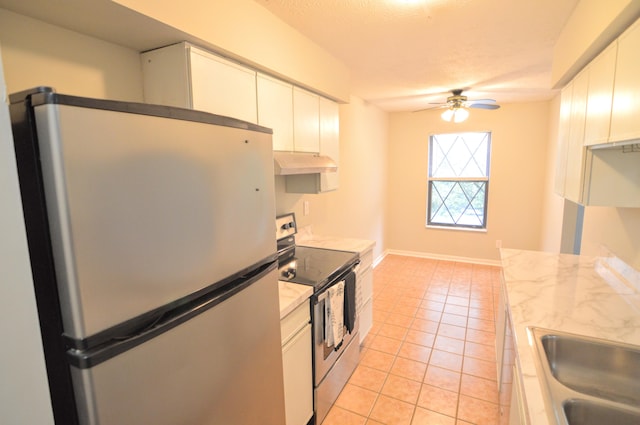 kitchen with white cabinetry, sink, ceiling fan, stainless steel appliances, and light tile patterned flooring