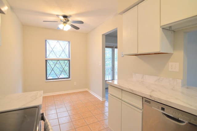 kitchen with light tile patterned floors, white cabinetry, and appliances with stainless steel finishes