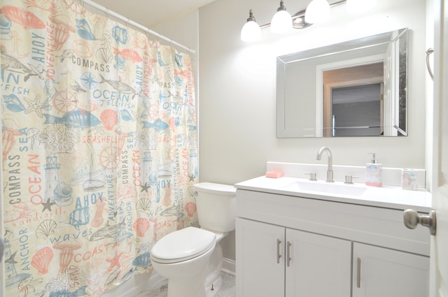 bathroom featuring vanity, toilet, and curtained shower