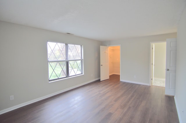 spare room featuring dark hardwood / wood-style floors