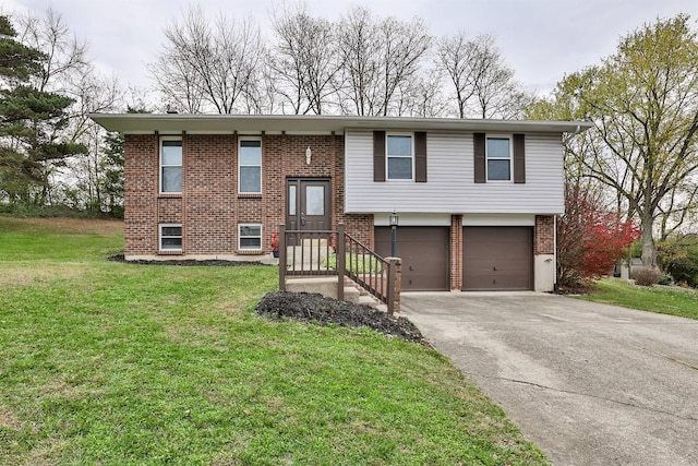 split foyer home featuring a front yard and a garage