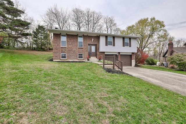 raised ranch with a front lawn and a garage