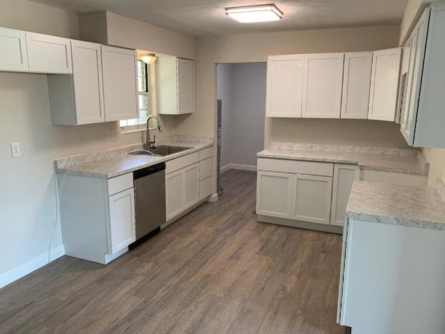 kitchen with white cabinets, dishwasher, and sink