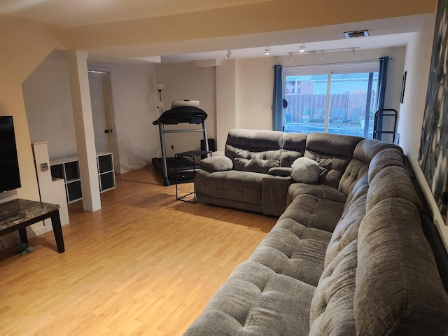 living room with light hardwood / wood-style floors