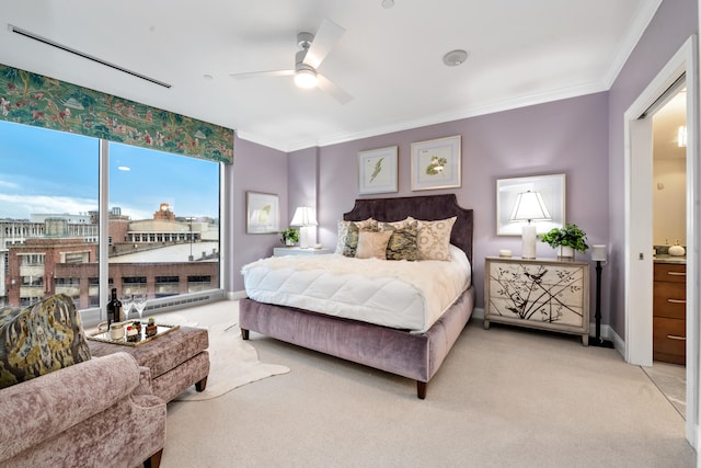 carpeted bedroom featuring ceiling fan and ornamental molding