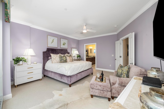 carpeted bedroom with ceiling fan, crown molding, and ensuite bath