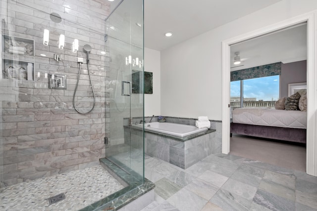 bathroom featuring ceiling fan and separate shower and tub