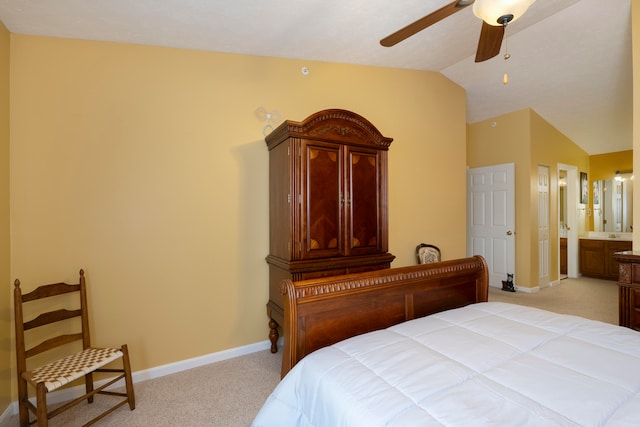 carpeted bedroom with connected bathroom, ceiling fan, and lofted ceiling