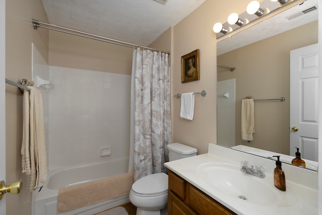 full bathroom with shower / tub combo, vanity, a textured ceiling, and toilet