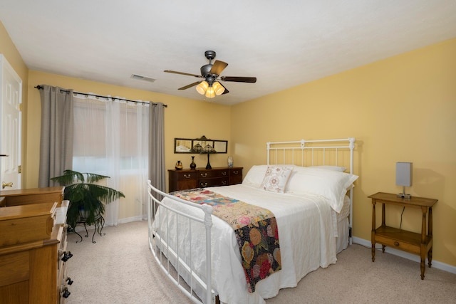 bedroom featuring ceiling fan and light colored carpet