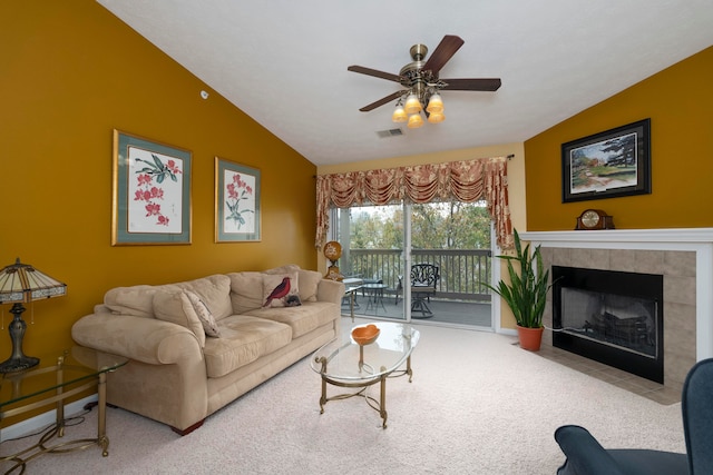 living room featuring ceiling fan, a fireplace, carpet, and lofted ceiling