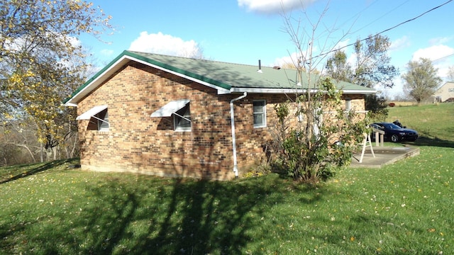 3655 Squiresville Rd, Owenton, KY 40359 - view of home's exterior featuring brick siding and a lawn