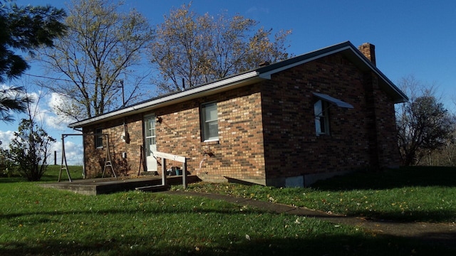3655 Squiresville Rd, Owenton, KY 40359 - view of side of property with a chimney, brick siding, and a yard