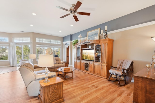 living room with recessed lighting, light wood-type flooring, and baseboards