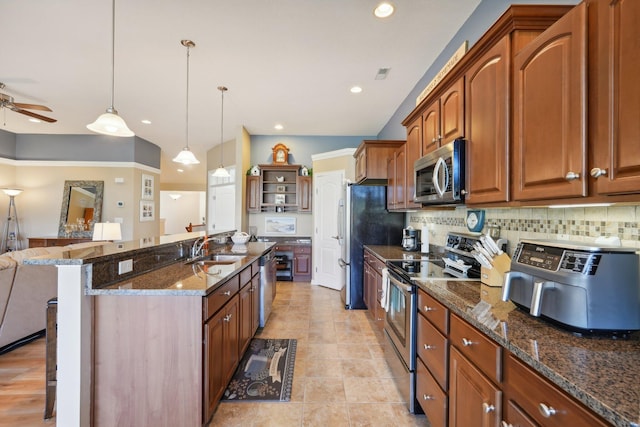 kitchen with a breakfast bar, open shelves, stainless steel appliances, decorative backsplash, and a sink