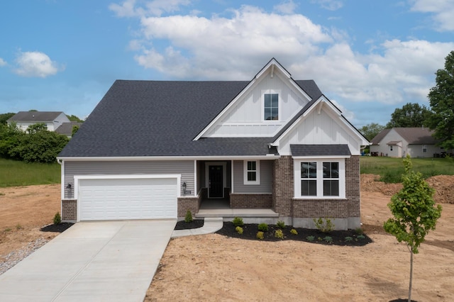 view of front of property featuring brick siding, a garage, driveway, and a porch