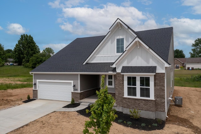 view of front of home with brick siding, concrete driveway, an attached garage, board and batten siding, and a shingled roof