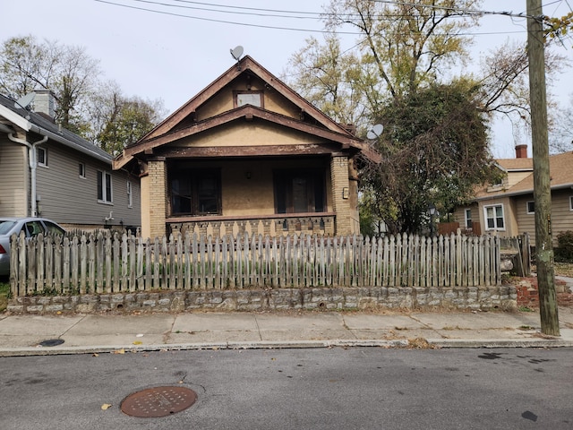 bungalow-style home featuring covered porch