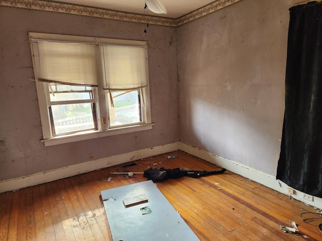 spare room featuring ceiling fan and hardwood / wood-style flooring