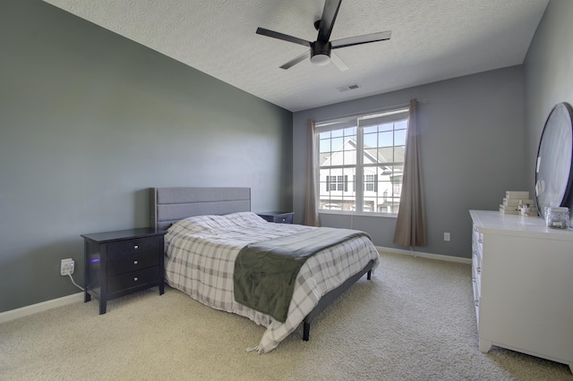 bedroom with light carpet, baseboards, and visible vents