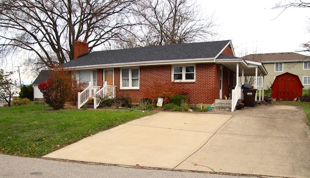 bungalow with a front yard and a storage shed