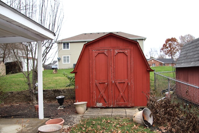 view of outbuilding featuring a yard