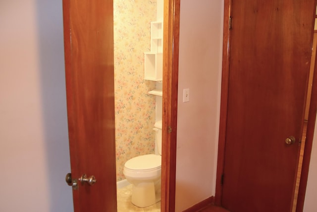 bathroom with tile patterned flooring and toilet