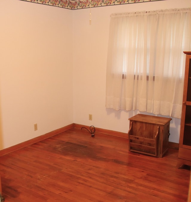 spare room featuring hardwood / wood-style flooring