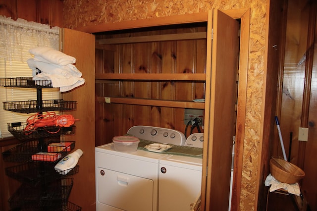 clothes washing area featuring washer and clothes dryer