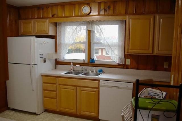 kitchen with white appliances and sink