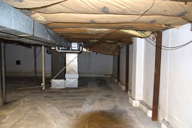 basement featuring heating unit