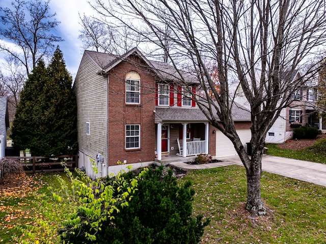 view of front of home with a porch and a front lawn