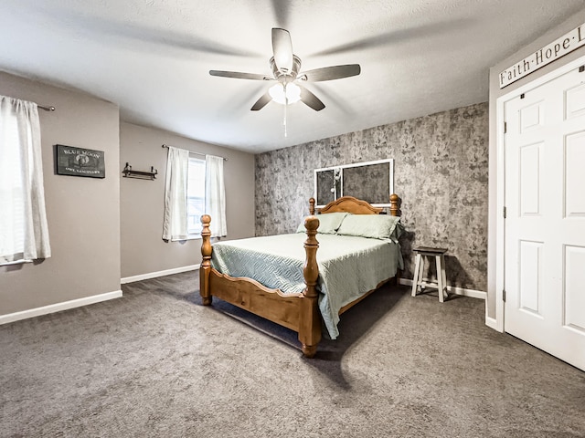 bedroom with carpet flooring, a textured ceiling, and ceiling fan