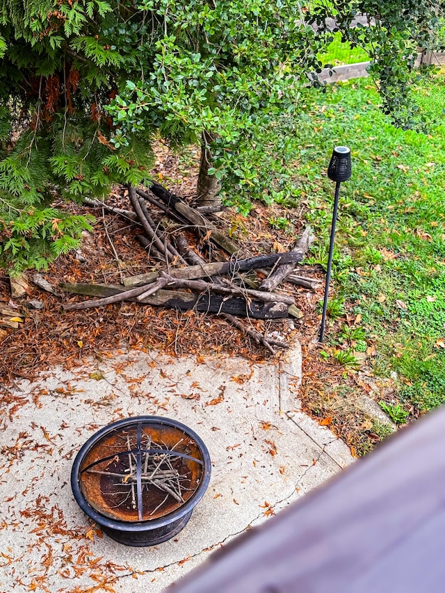 exterior details with an outdoor fire pit