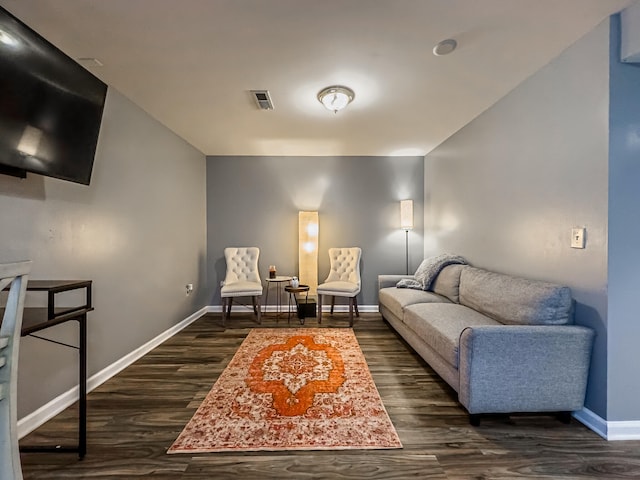 living room with dark hardwood / wood-style floors