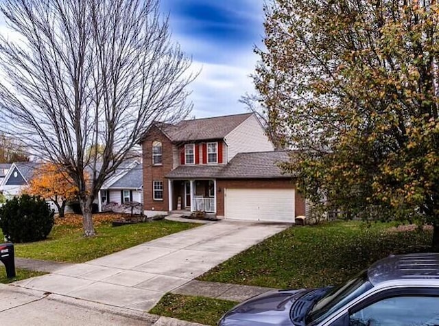 10258 Cardigan Dr, Union, KY 41091 - view of front of property featuring concrete driveway, a front yard, and a garage