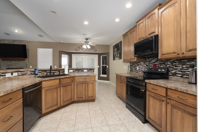 kitchen featuring black appliances, a sink, backsplash, brown cabinetry, and light tile patterned floors