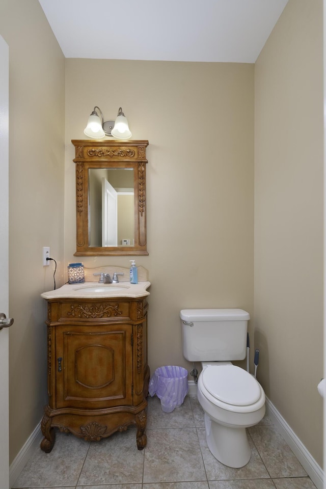 bathroom with vanity, tile patterned floors, and toilet