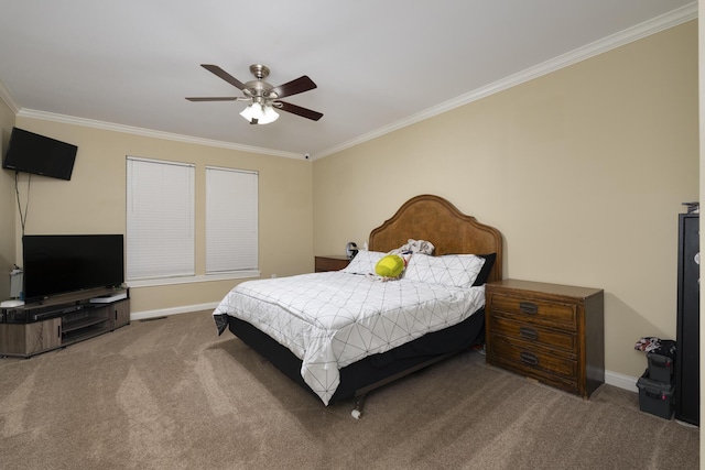 carpeted bedroom with ornamental molding and ceiling fan