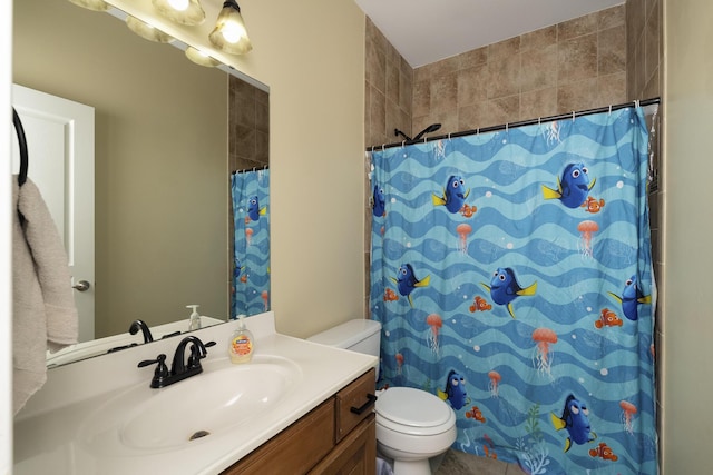 full bathroom featuring toilet, vanity, and a shower with curtain