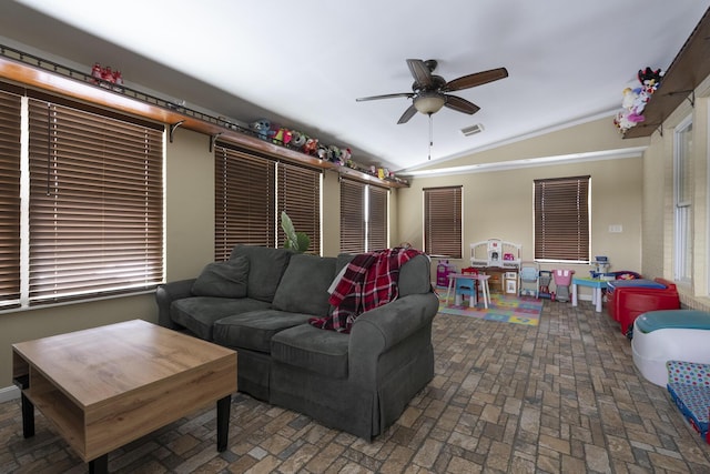 living area with lofted ceiling, brick floor, a ceiling fan, and visible vents