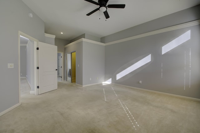 unfurnished room featuring ceiling fan and light colored carpet