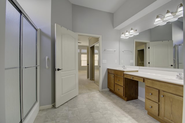 bathroom with vanity and walk in shower