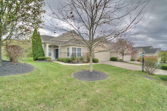 view of front of property featuring a front yard and a garage