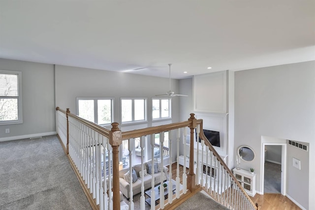 hall with hardwood / wood-style flooring